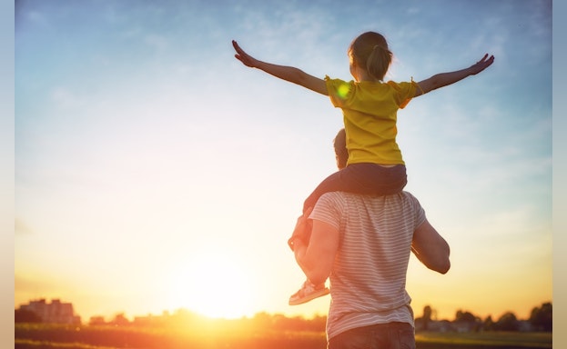 Man with child on shoulders