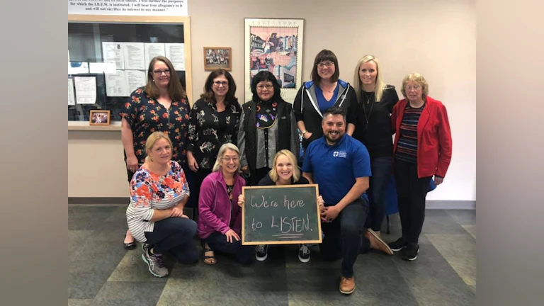 Group of people with chalkboard