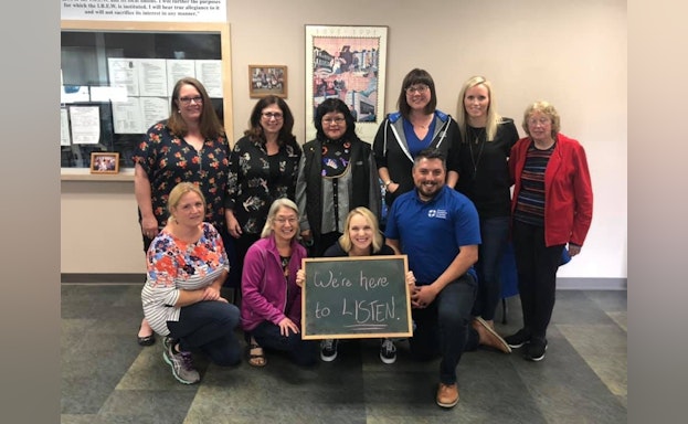 Group of people with chalkboard
