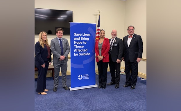 Group of people posing for photo