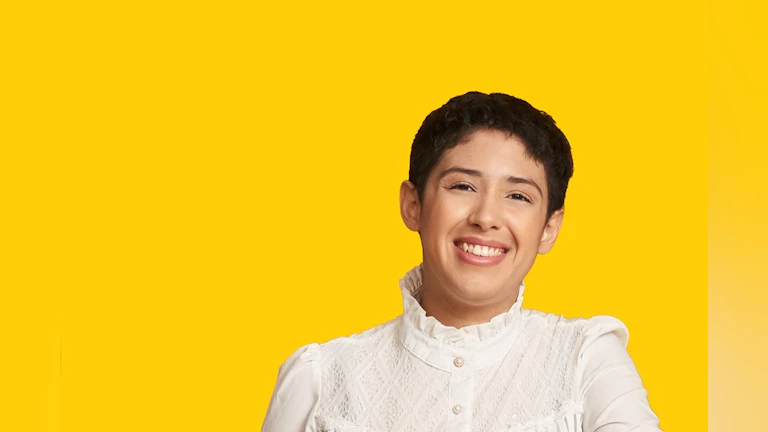 Woman in front of yellow background