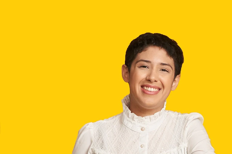 Woman in front of yellow background
