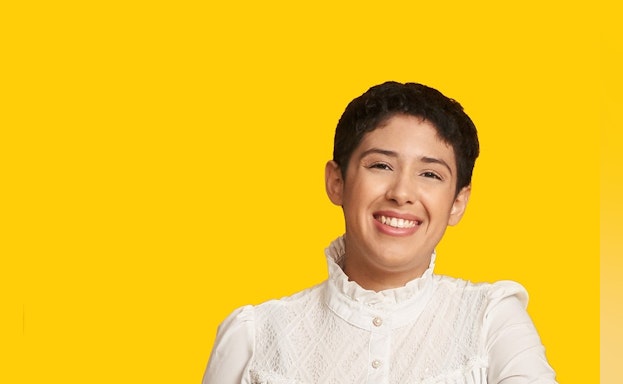 Woman in front of yellow background