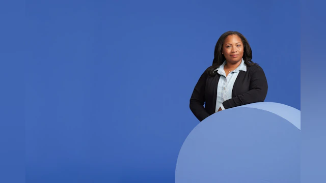 Woman in front of blue background