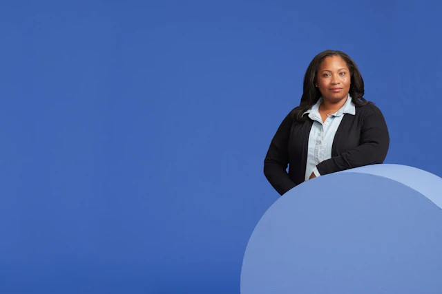 Woman in front of blue background