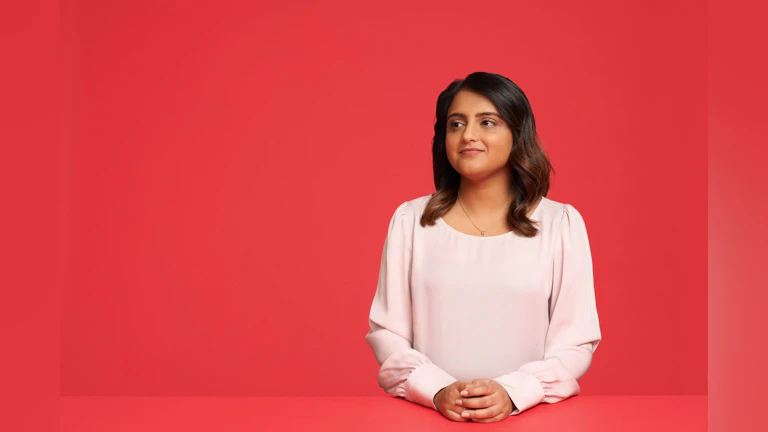 Woman in front of red background