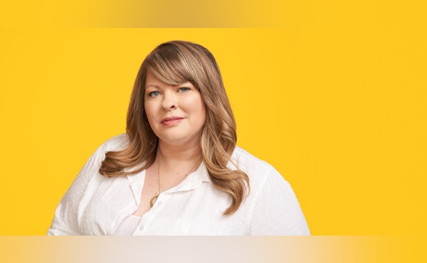 Woman in front of yellow background