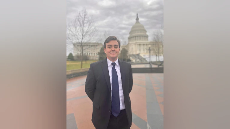 Man standing in front of capitol building