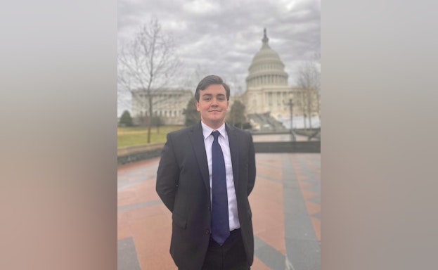 Man standing in front of capitol building