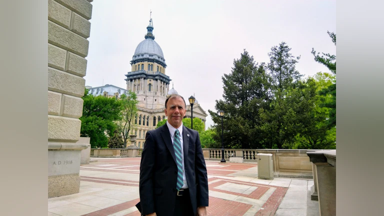 Man in front of capitol building