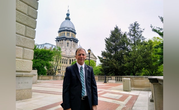 Man in front of capitol building