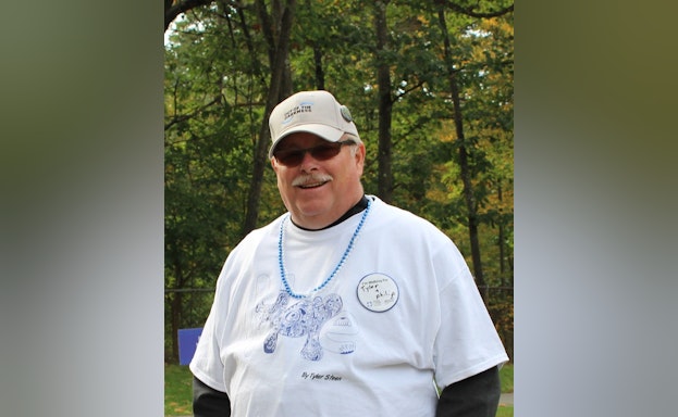 Man smiling in forest