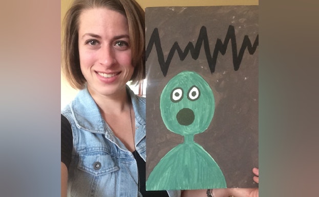 Woman holding painting