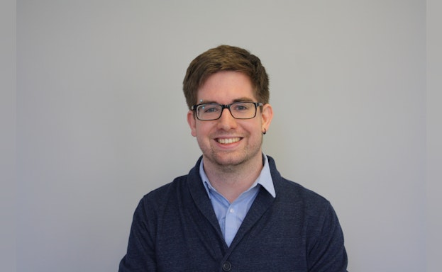 Man standing in front of gray background
