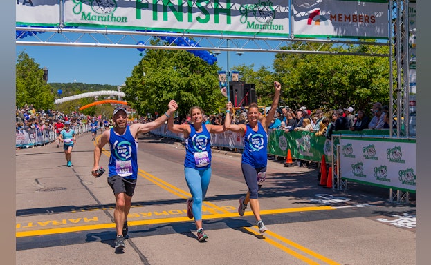 Runners crossing a finish line