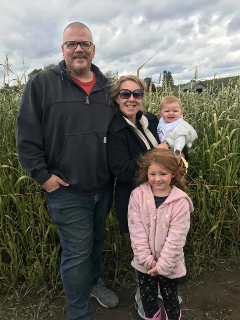 Group standing in corn field