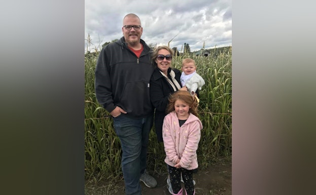 Group standing in corn field