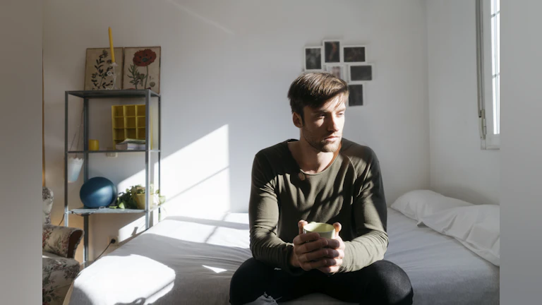 Man sitting on bed