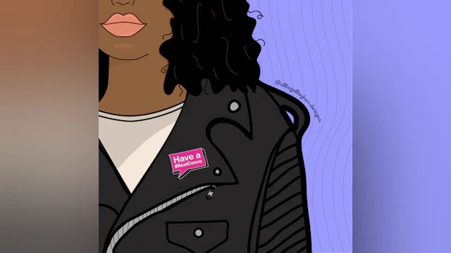 Have a #RealConvo pin on woman's jacket