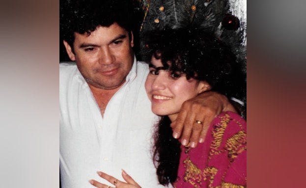 Man and woman in front of christmas tree