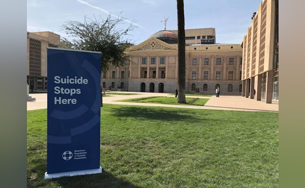 Sign in front of building