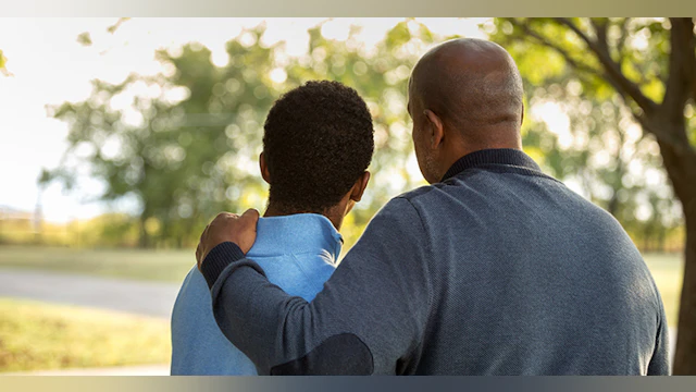 Father and son hugging