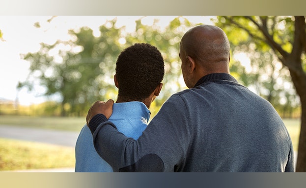 Father and son hugging