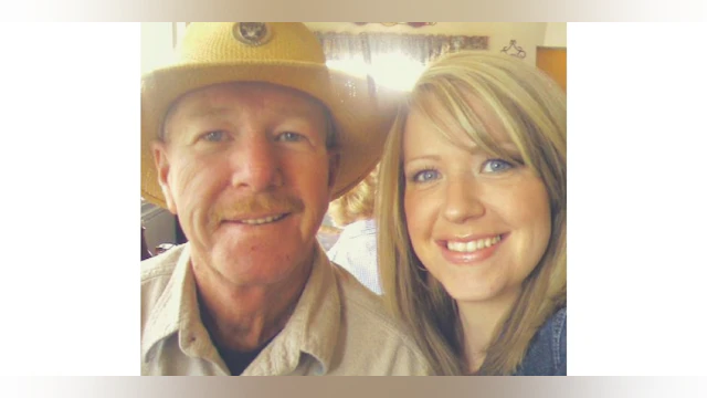 Father and daughter smiling