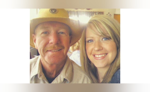 Father and daughter smiling