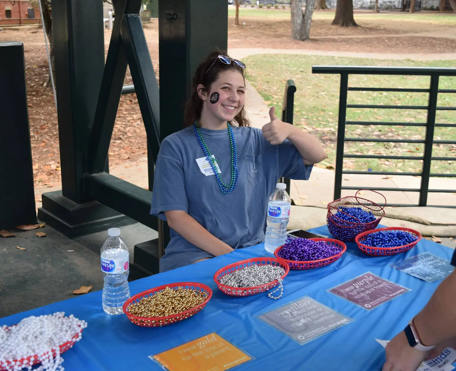 Volunteer at Out of the Darkness Walk Honor Bead Table