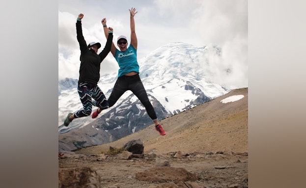 Jumping with mountains in the background