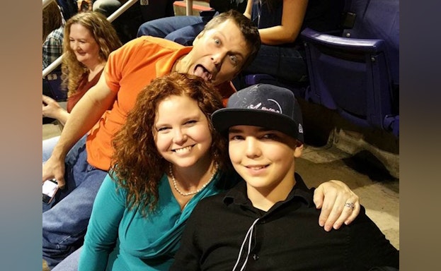 three people smiling and laughing