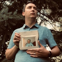 Man holding photograph