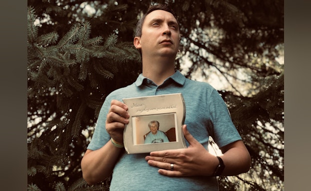 Man holding photograph