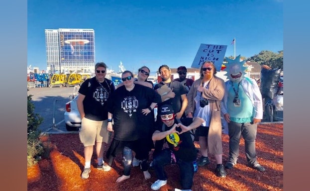 group of men and women smiling