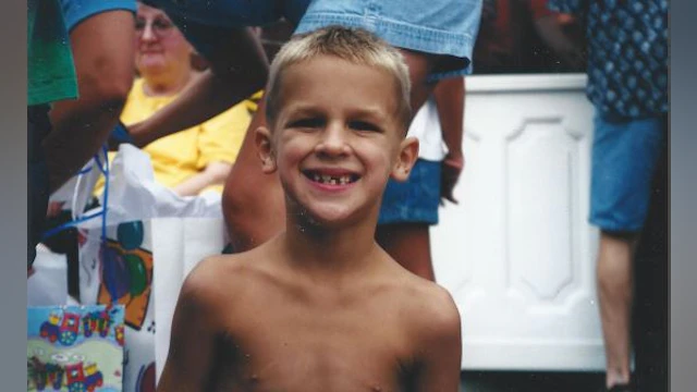 Boy looking forward and smiling