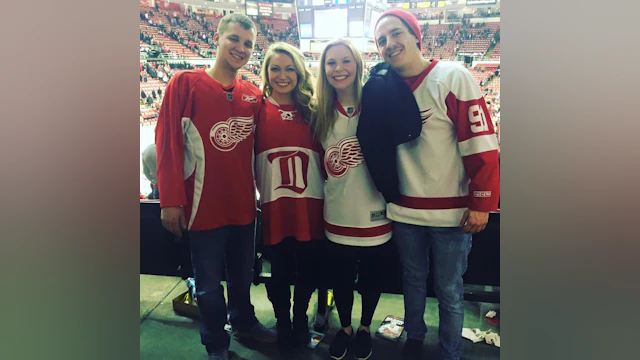 Group standing in stadium