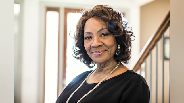 Older woman smiling in home