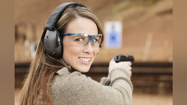 Woman holding gun