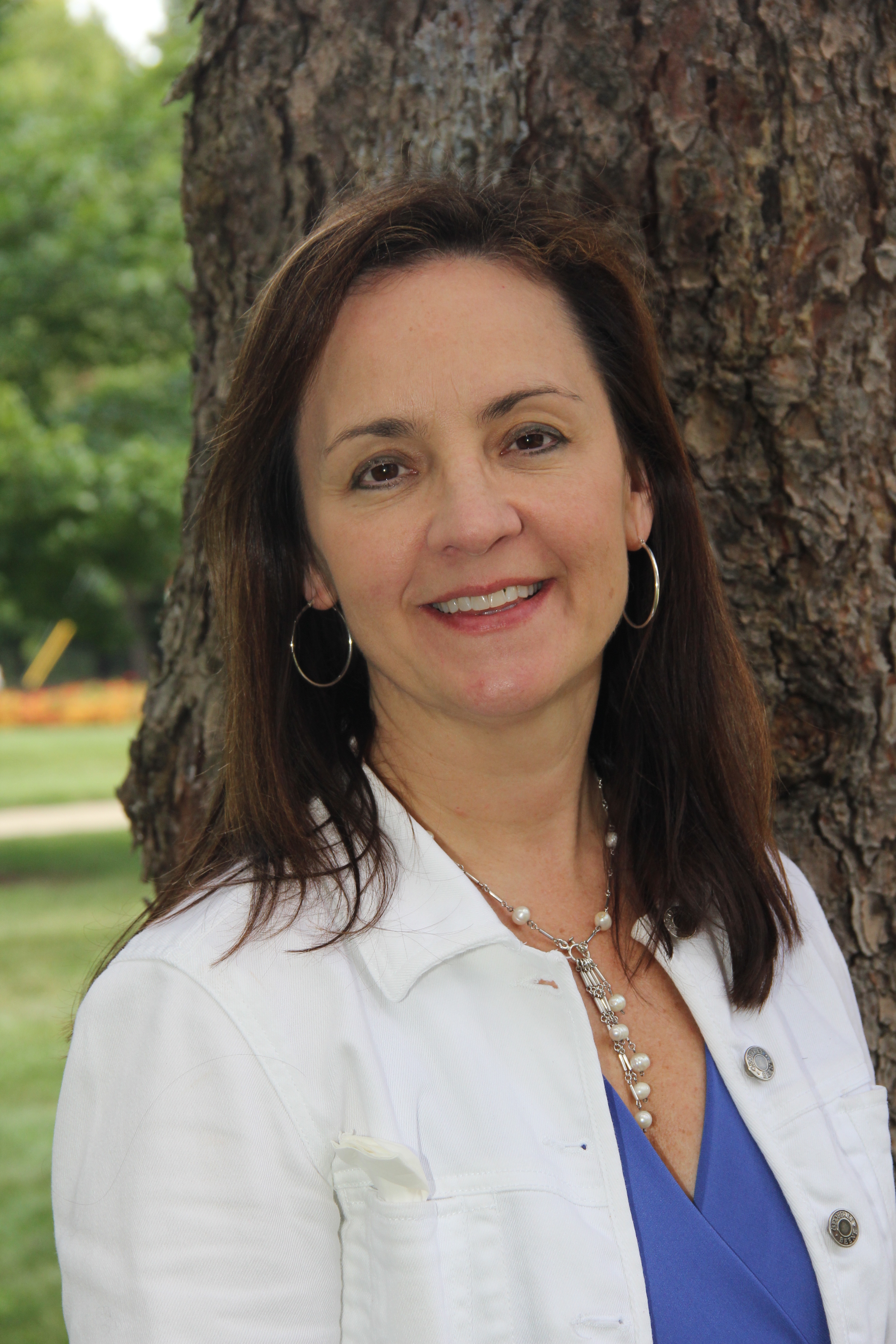 Woman in front of tree