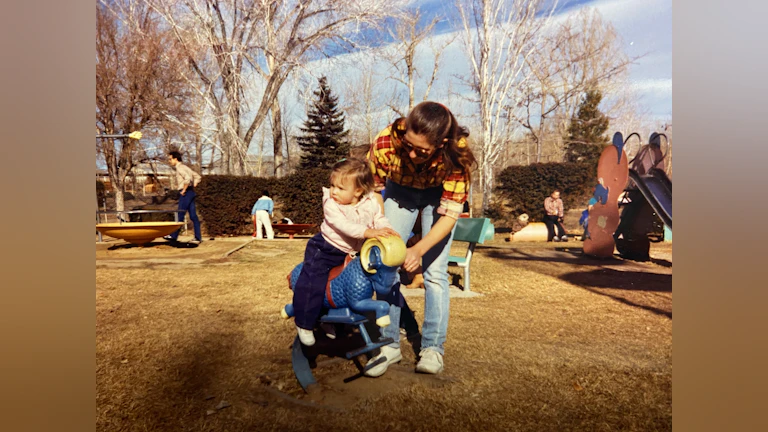 Woman and child at playground