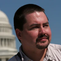 Man in front of capitol building