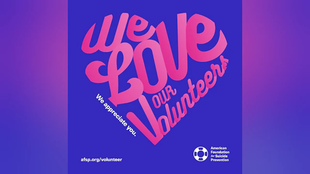 A blue background with fuchsia text that says "We Love Our Volunteers," in the shape of a heart.