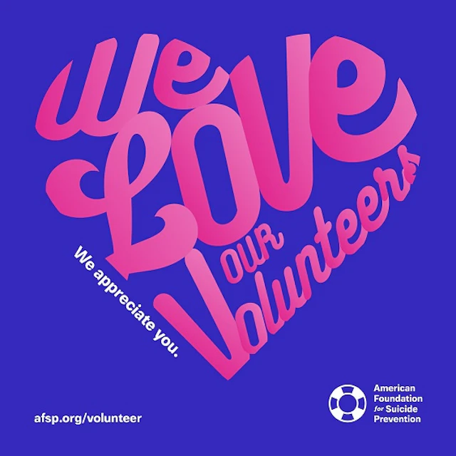 A blue background with fuchsia text that says "We Love Our Volunteers," in the shape of a heart.