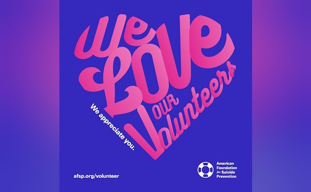 A blue background with fuchsia text that says "We Love Our Volunteers," in the shape of a heart.
