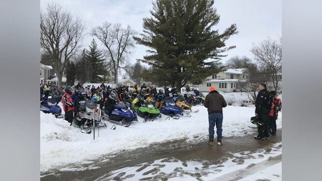 Snowmobiles and riders at Ride to Fight Suicide