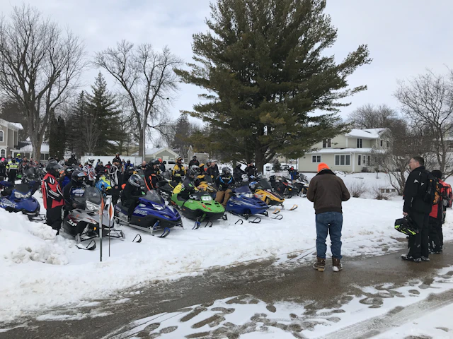 Snowmobiles and riders at Ride to Fight Suicide
