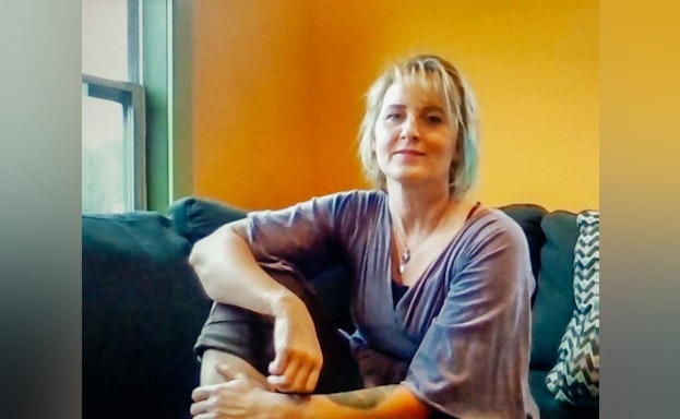 Woman sitting on sofa