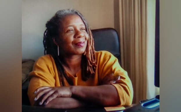 Woman smiling and looking off camera