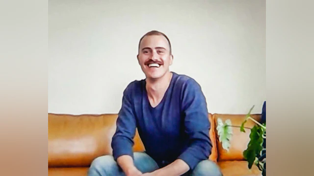 Man sitting and smiling